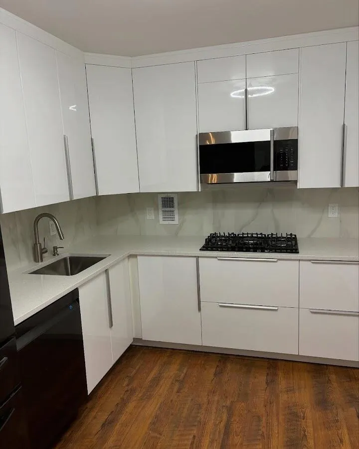 Restored kitchen with white cabinets after water damage in Providence